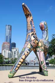 Artwork at Birrarung Marr with Melbourne city centre behind